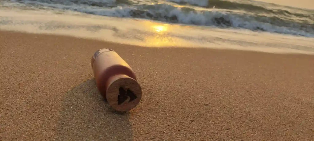 A terracotta bottle along the sea shore
