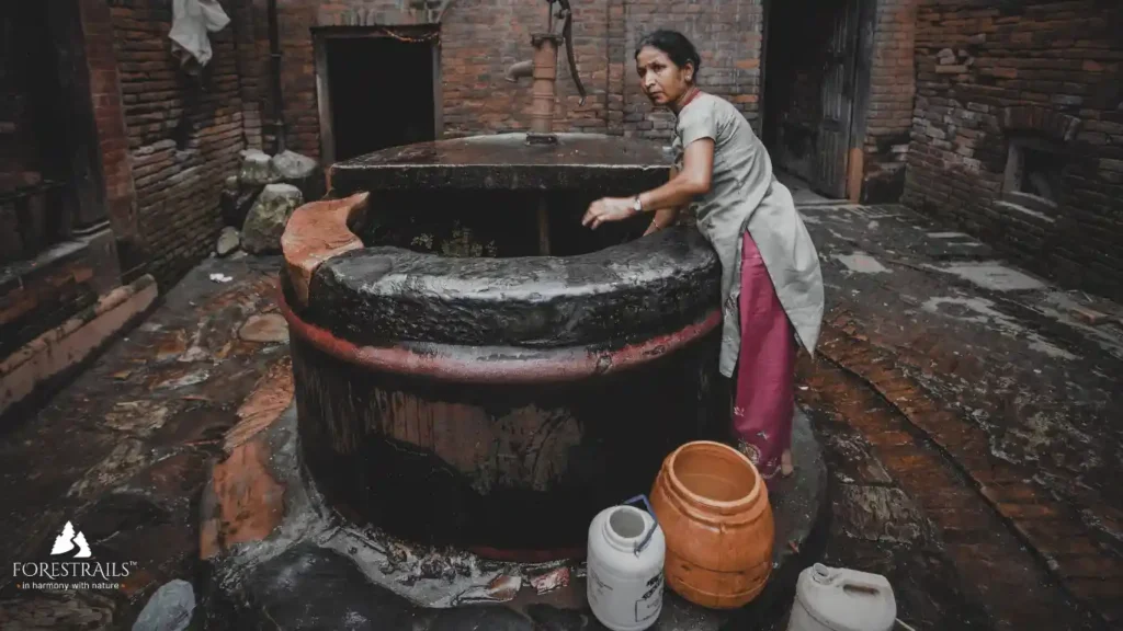 lady drawing water from the ancient well